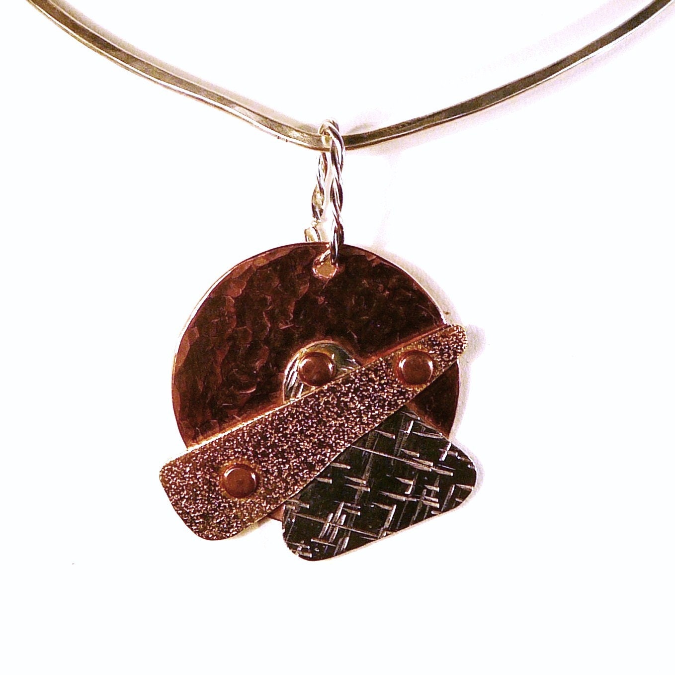 Sterling silver, copper and brass pendant
