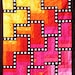 Quilt--Hot Colors of Yellow, Orange, Red and Pink Form the Background for a Black Maze with White Appliqued Circles