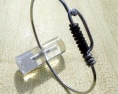 Stainless steel bike spoke bracelet with black spoke accent