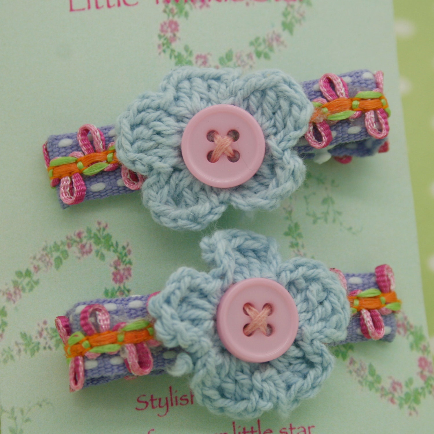 a pair of crochet flower clips