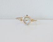 Vintage PIEVA NICOL quartz gold and white wrist watch.