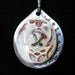 Red and white ceramic buttons