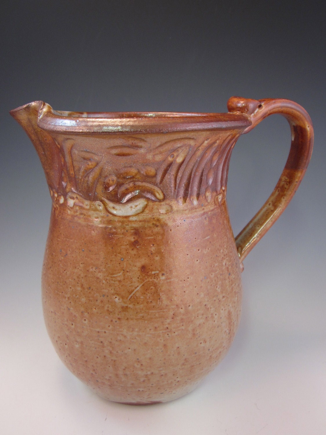 Stoneware Pitcher with Carved Decoration