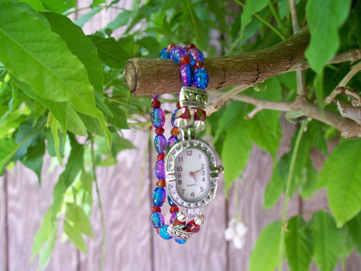Practicality and Beauty,  Lovely Oval Face Silver Watch on colorful Hand Strung Band.