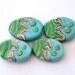 Handmade glass beads - 4 pressed Lampwork beads / pendants in turquoise, green and silvered ivory