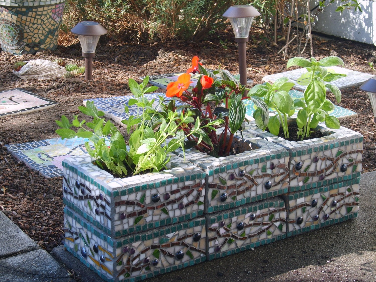 Upcycled mosaic herb garden planter with olive branch pattern