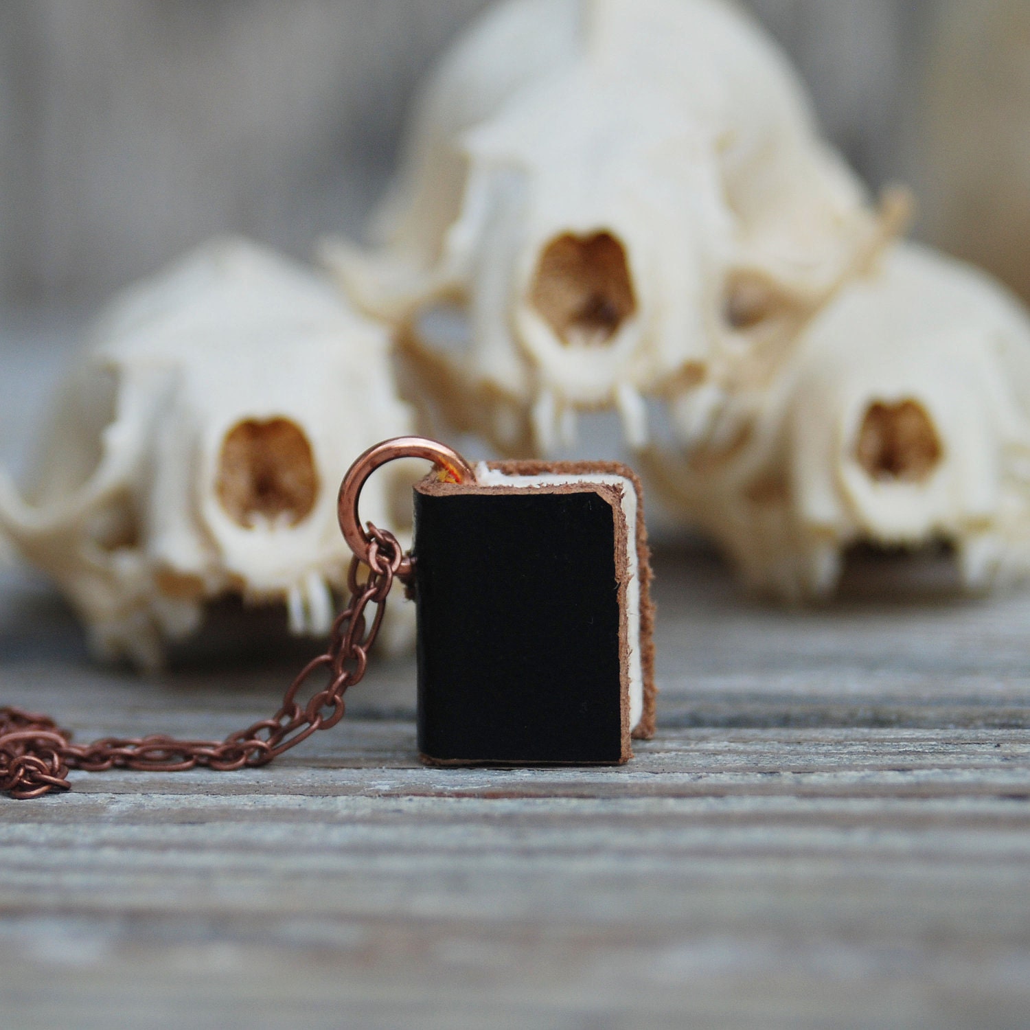 Book Necklace: Not Complicated, black leather with brown edge, small.