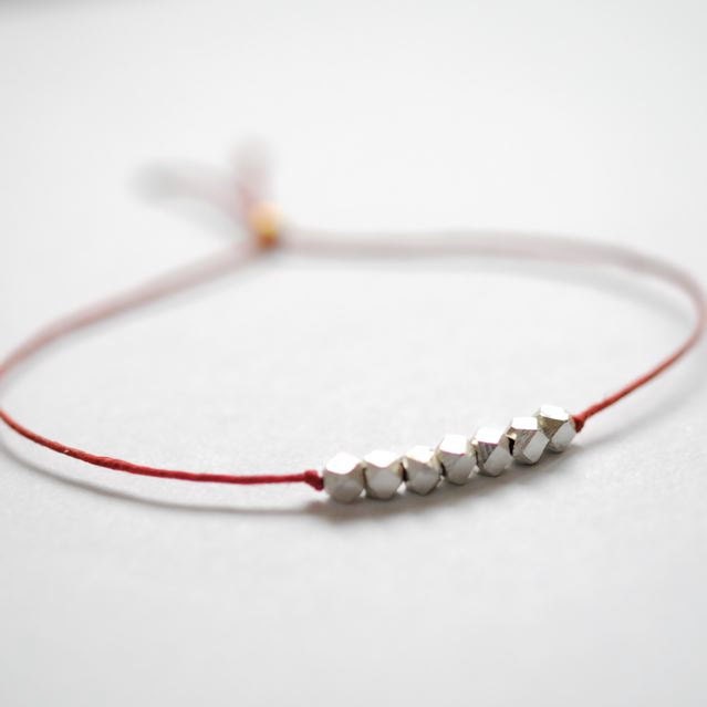 Wish bracelet, fine silver nugget beads on Red Irish linen cord