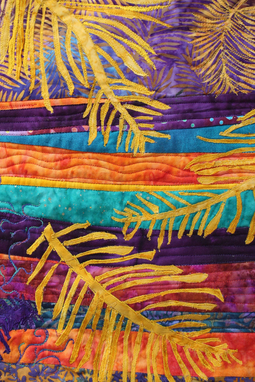 abstract wall quilt with applique ferns and  fun quilting  in purple and gold batiks