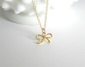 Tiny little bow in gold vermeil, delicate modern jewelry