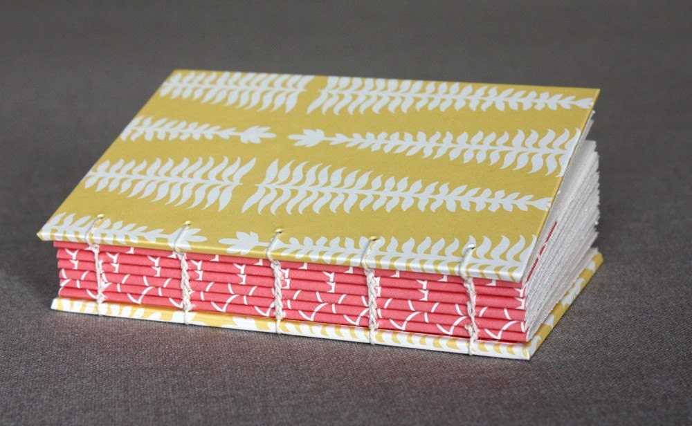 Small journal or sketchbook (yellow and pink patterns)