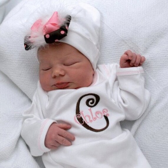 Layette Gown with Infant Hat. Monogrammed in Brown and Pink Curlz Font. Infant Hat with Brown and Pink Bow