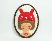 A Red Bunny and a Girl felt pin