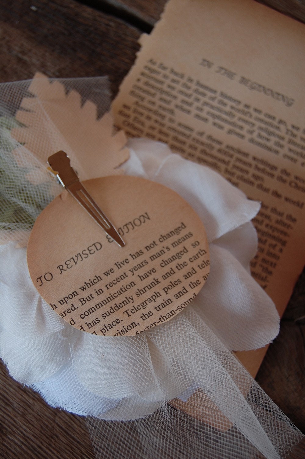 White gardenia with vintage book leaves