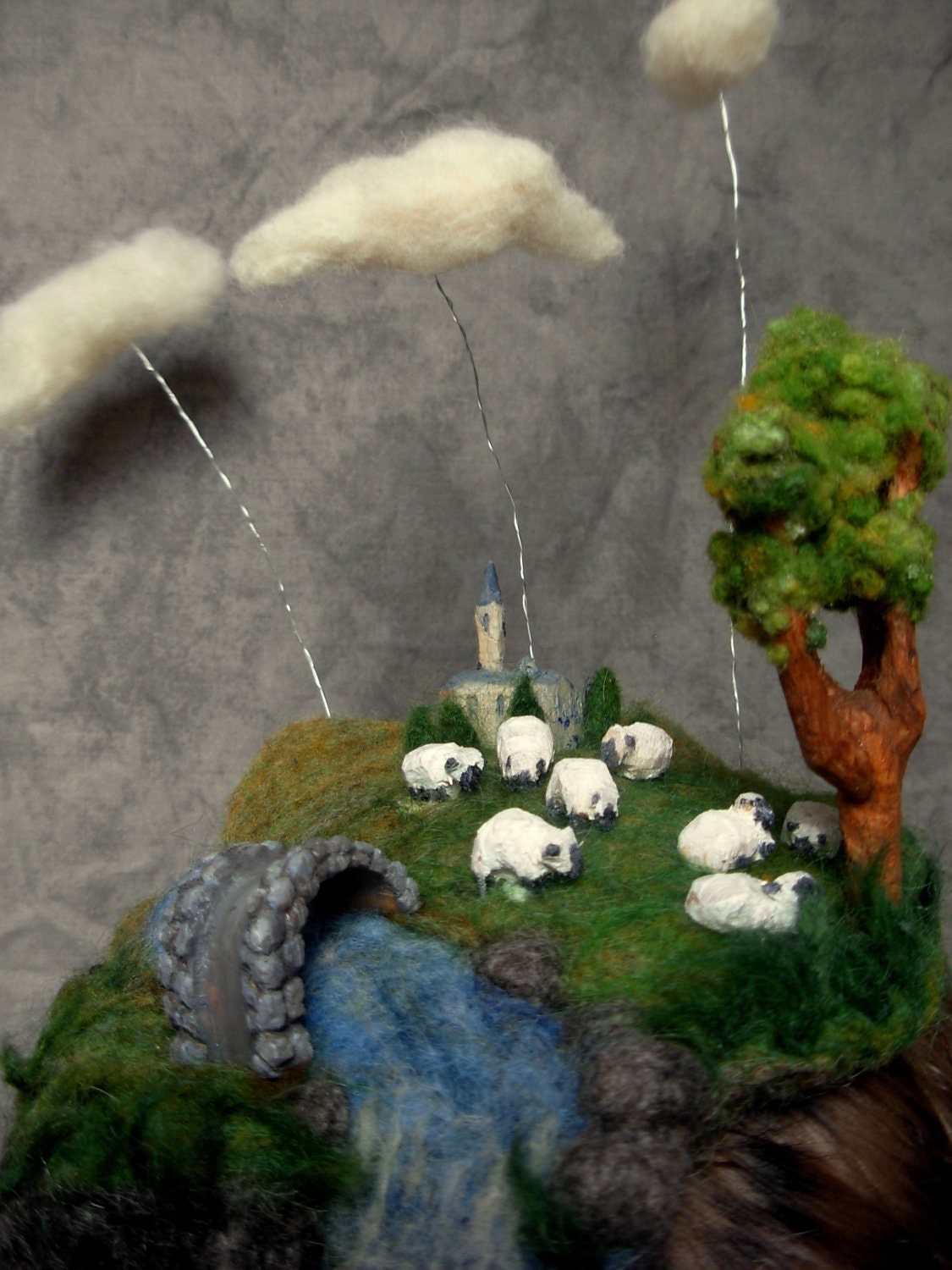 Needle Felted Hat -- Miniature Landscape of clouds, sheep grazing, chapel, river, and bridge hand carved out of wood