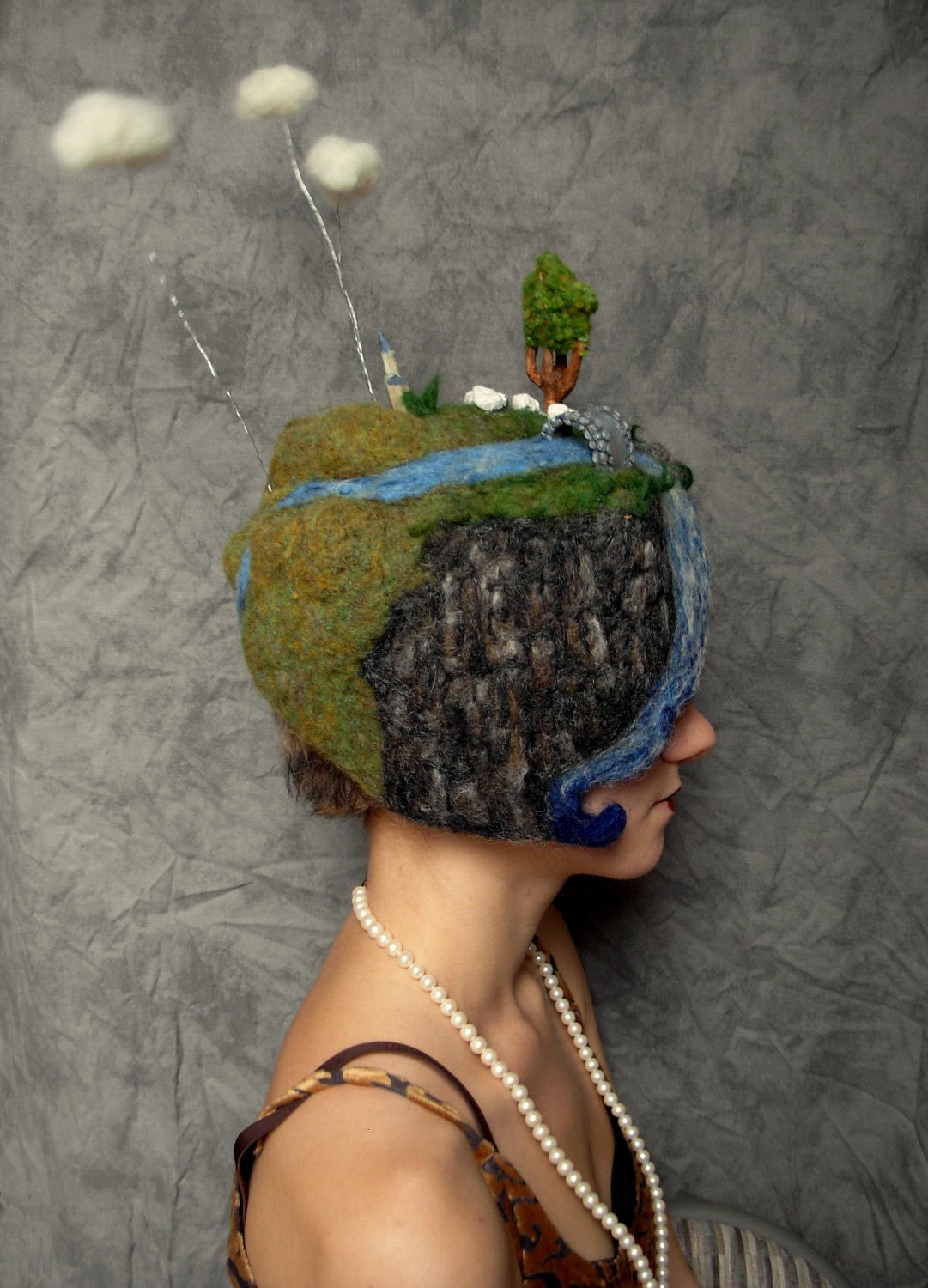Needle Felted Hat -- Miniature Landscape of clouds, sheep grazing, chapel, river, and bridge hand carved out of wood