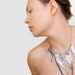 Grey metallic leather feather necklace