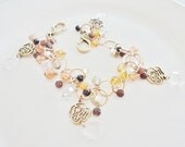 vintage jewelry super long adjustable gold charm  bracelet with lots of beads and charms