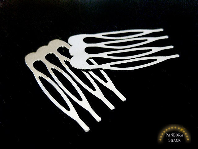 24 Silver Metal Hair combs. Plain combs.1/8 inch wide with 4 teeth. Create your own hair accessories with easy to glue on surface. Wholesale