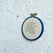 cursive typewritten on fabric wall hanging hoop art - blue - richie tenenbaum