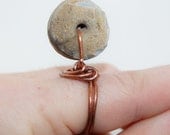Fossil crinoid ring in copper