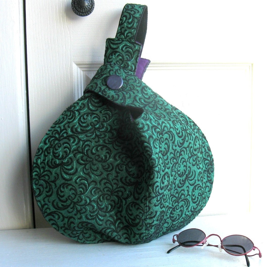 A beautiful emerald green bag to look very glam.