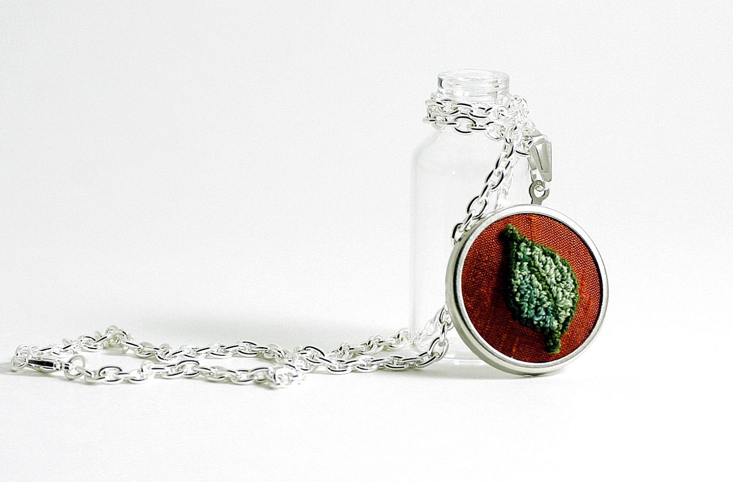 Green Leaf Necklace in Silver on Orange Silk. Punch Needle Embroidery. Rustic, Woodland Jewelry. by Harp and Thistle