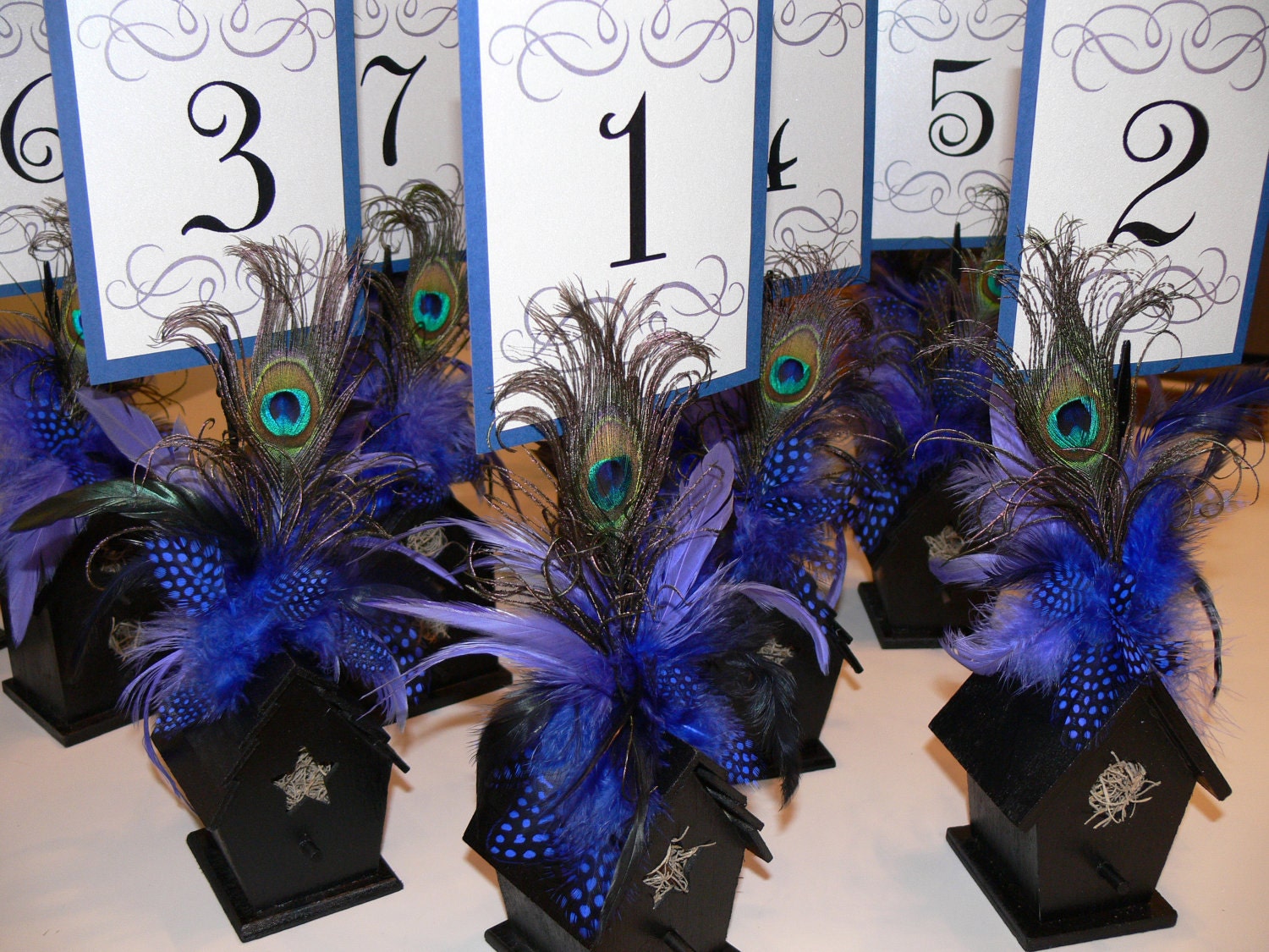 Birdhouse table number holders with Peacock, maribou and guinea feathers in your choice of colors