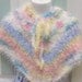 Baby poncho, hand knitted, baby girls, soft pastel colored with floral appliques