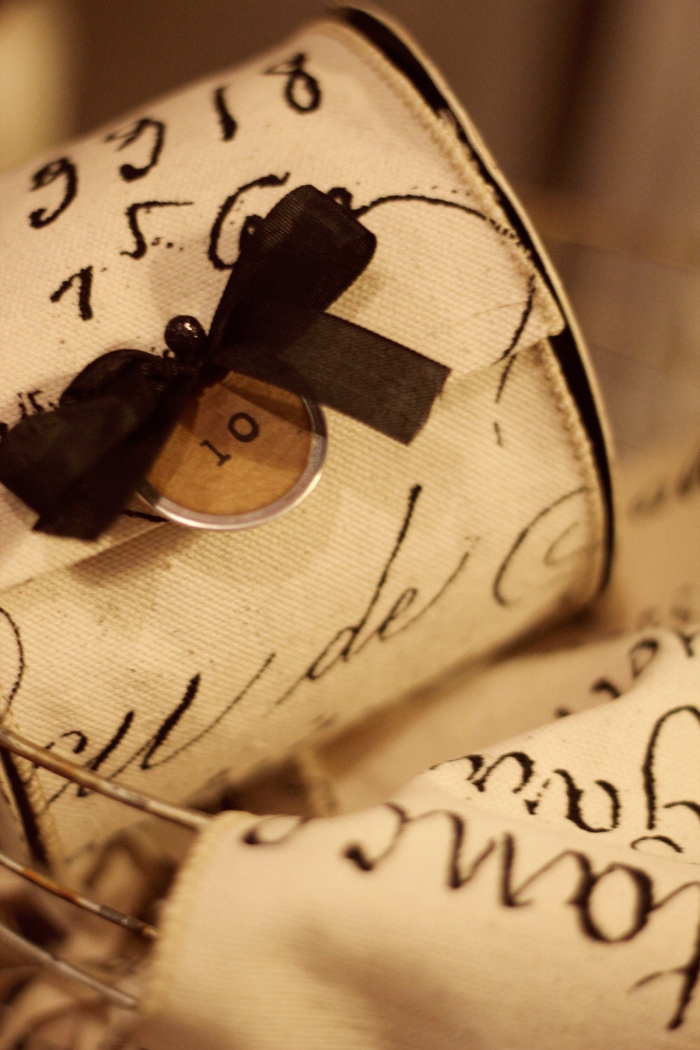 10 yard roll of wired black french labels on natural linen