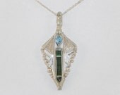 Faceted swiss blue topaz and tourmaline crystal sterling argentium silver wire wrap pendant