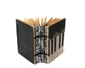Paula Abdul's Little Coptic Journal in Piano Black