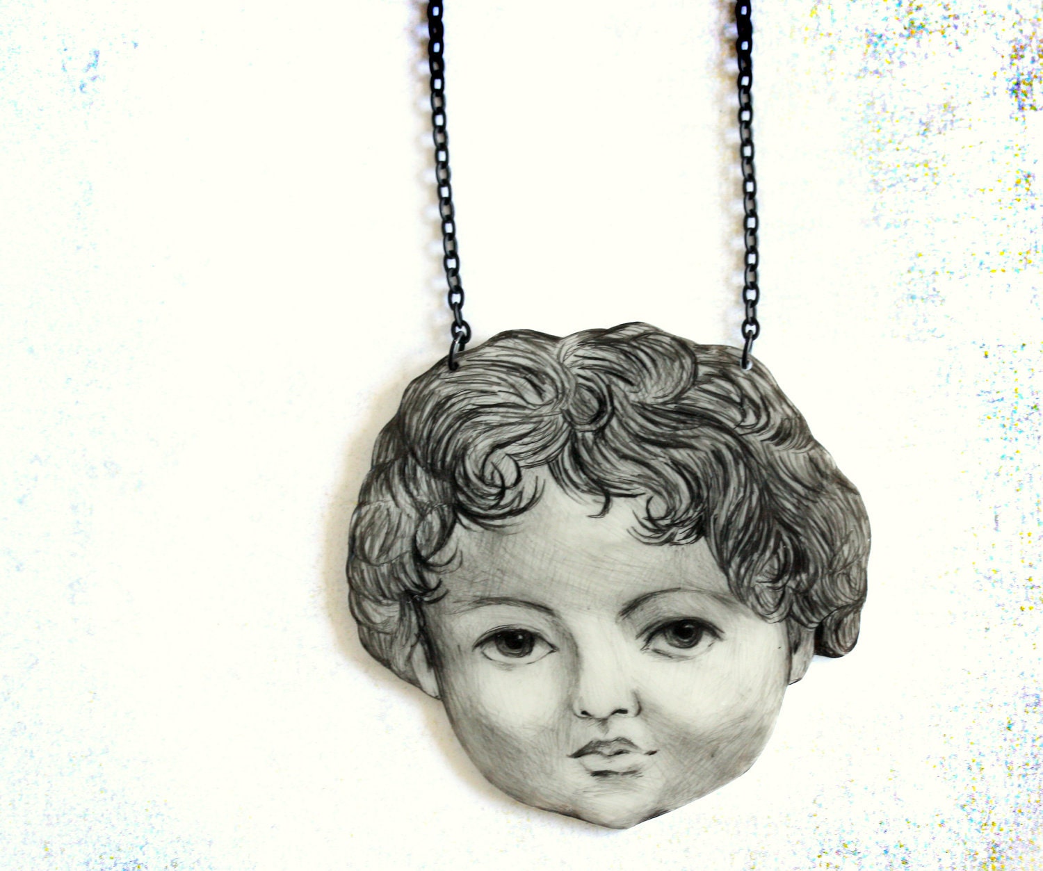 Doll head necklace -pendant, drawing on plastic