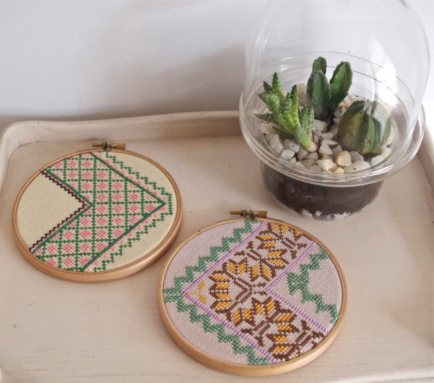 Pair of vintage embroidered zig zag wall art hoops