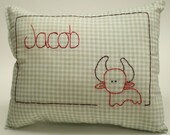 Jacob is a Taurus baby birth pillow in green