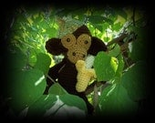Montey the Monkey, 9 1/2" from head to seat.  Comes complete with its own banana.