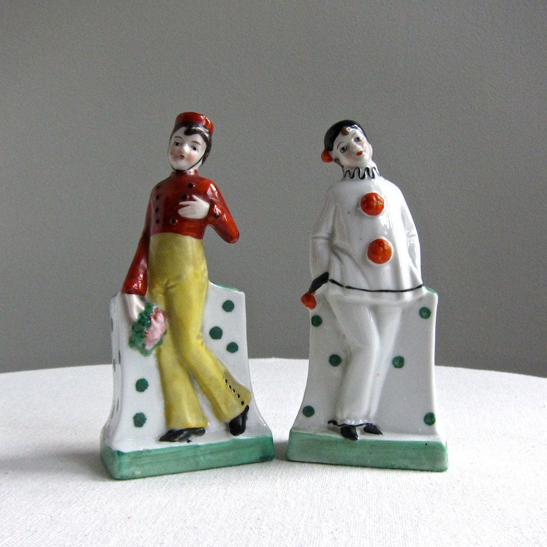 Two German Porcelain Figures of a Clown and a Bellhop, 1930s