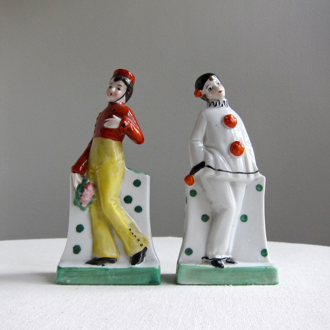 Two German Porcelain Figures of a Clown and a Bellhop, 1930s