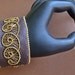 wire woven spiral and leather bracelet