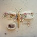 Moth made from vintage tablecloth.