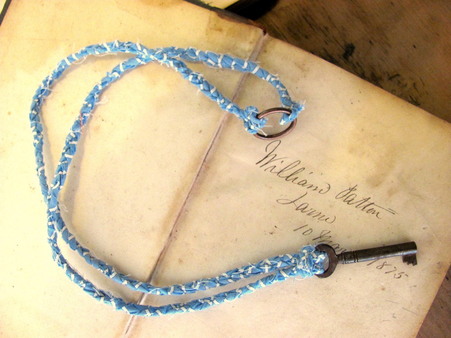 Vintage Skeleton Key with Braided Fabric Necklace. Medium. Rust with Blue and White Braid.