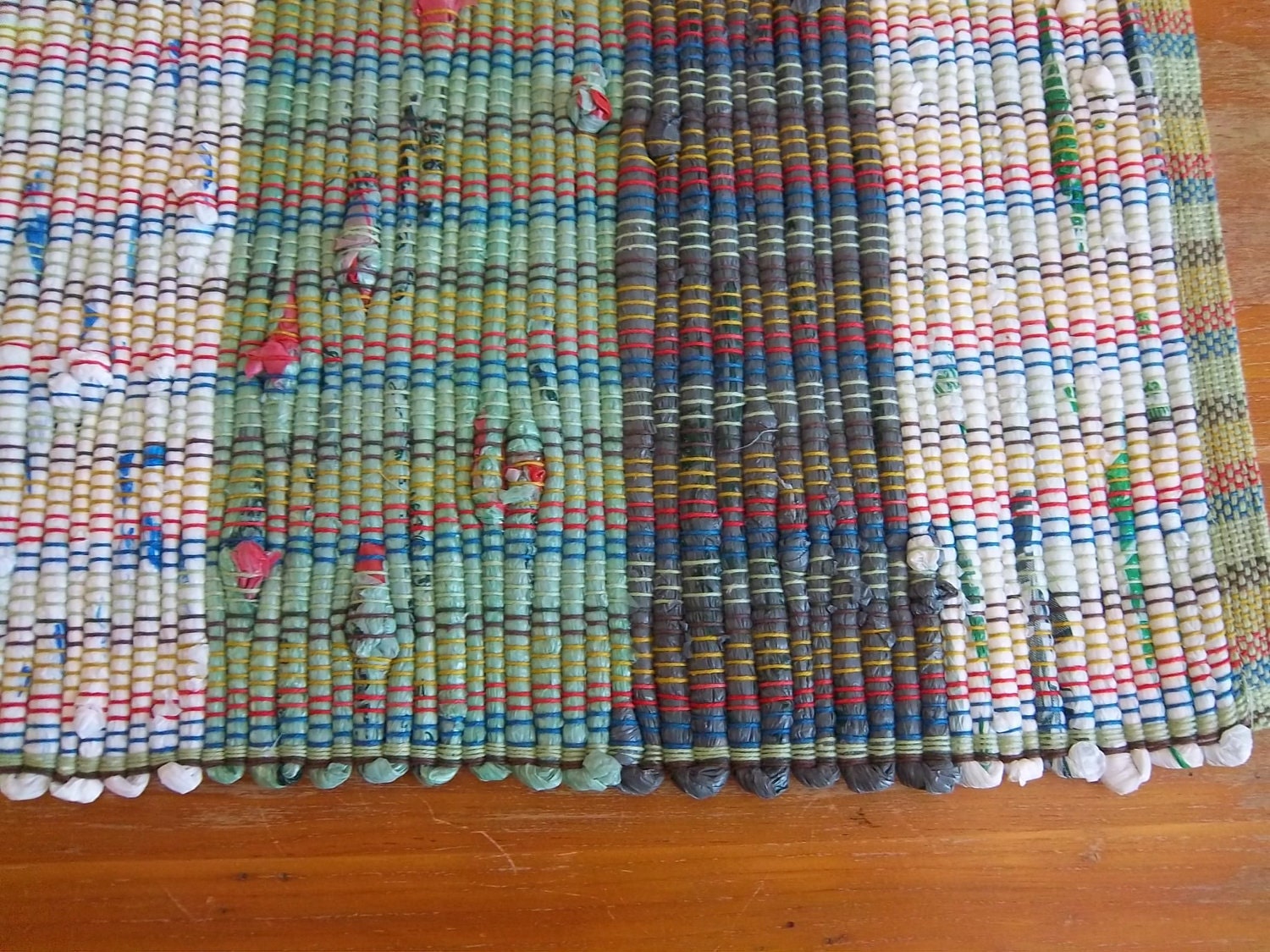 Green Upcycled Rug Woven from Plastic Grocery Bags.
