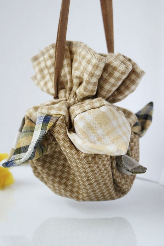 Small pouch in shades of beige and brown from remains recycled fabrics