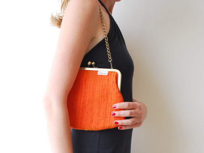 clutch purse. orange silk kiss lock purse. chain purse. snap purse