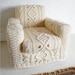 hand knitted cream aran armchair slip cover