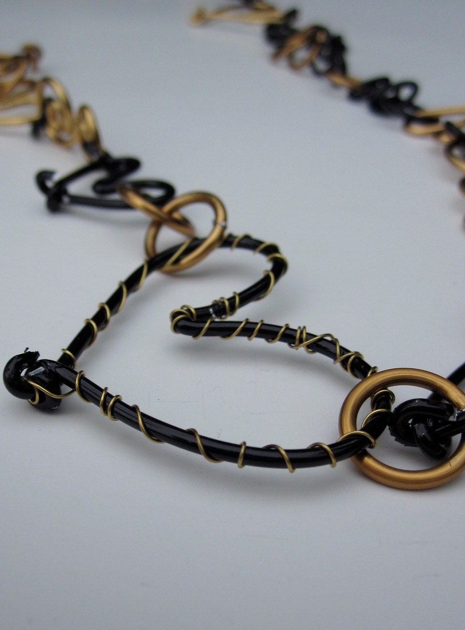Black and Gold Necklace With Hearts and Swirls