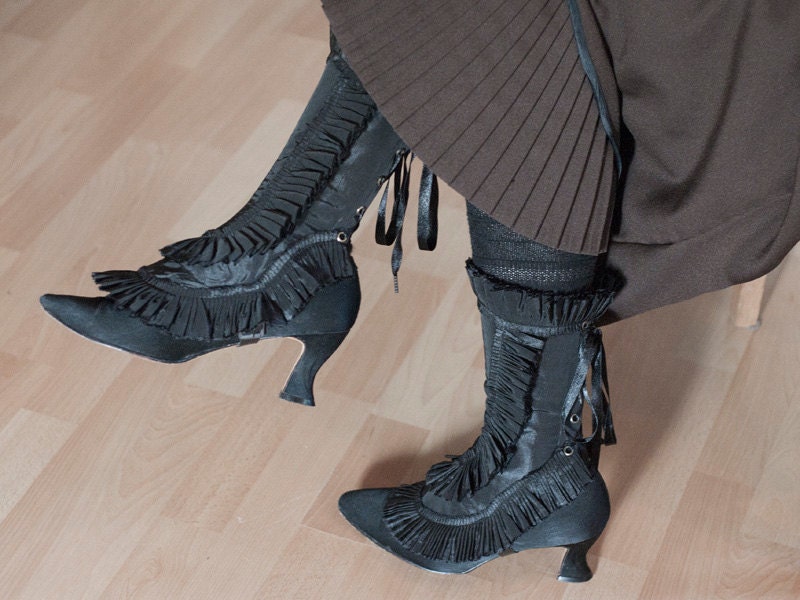 Black spats gaiters with ruffled trim in taffeta fabric