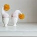 Knitted egg warmers with yellow pom. Set of 2