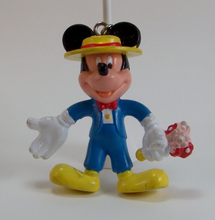 Five Mickey Mouse Collectibles Pez Dispenser, two Keyrings, Tomy car, and a stand up figure