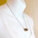 Copper glitter necklace in round hand blown glass necklace